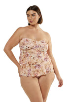 Brunette model wearing pink floral strapless tiered bandeau top