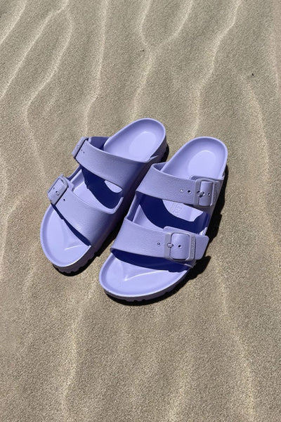 Women's light purple slide on sandals on beach