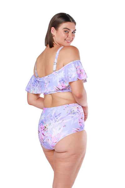Plus size model wearing lilac floral high waisted swim bottoms