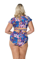 Back of model in studio wearing swim pant for curve women