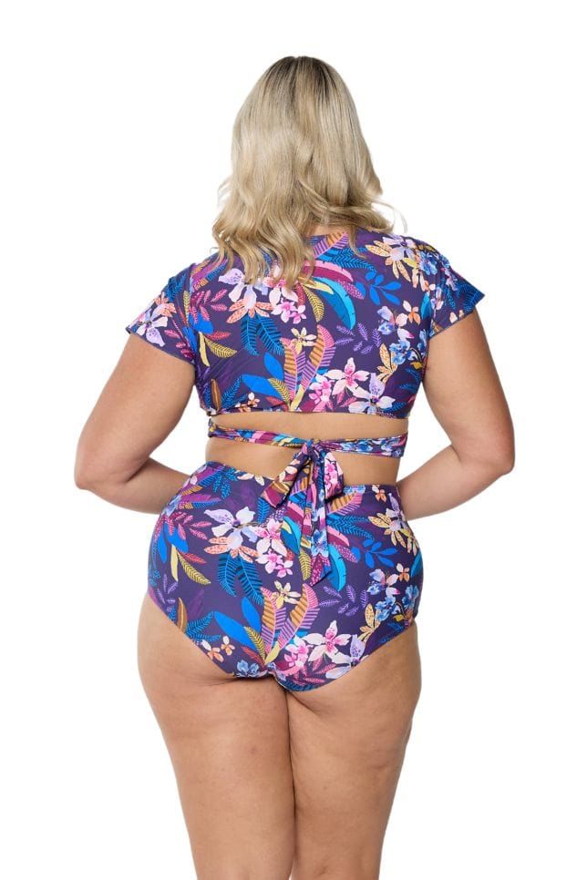 Back of model in studio wearing swim pant for curve women
