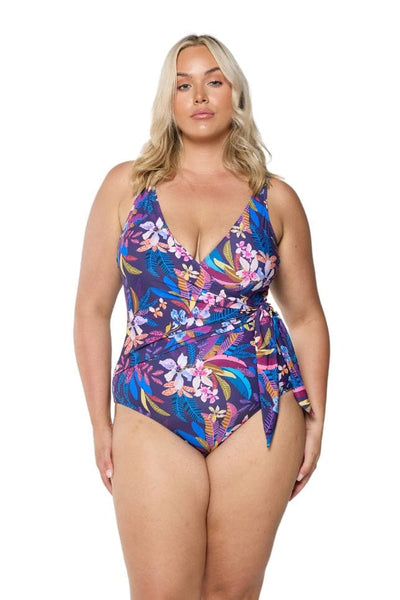 Front of plus size model wearing floral one piece with tie side detail 