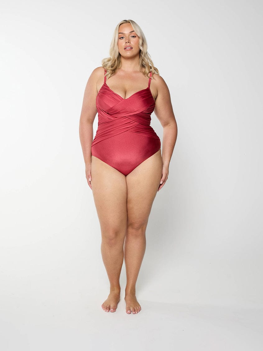 Woman in studio wearing plus size one piece with metallic fabric