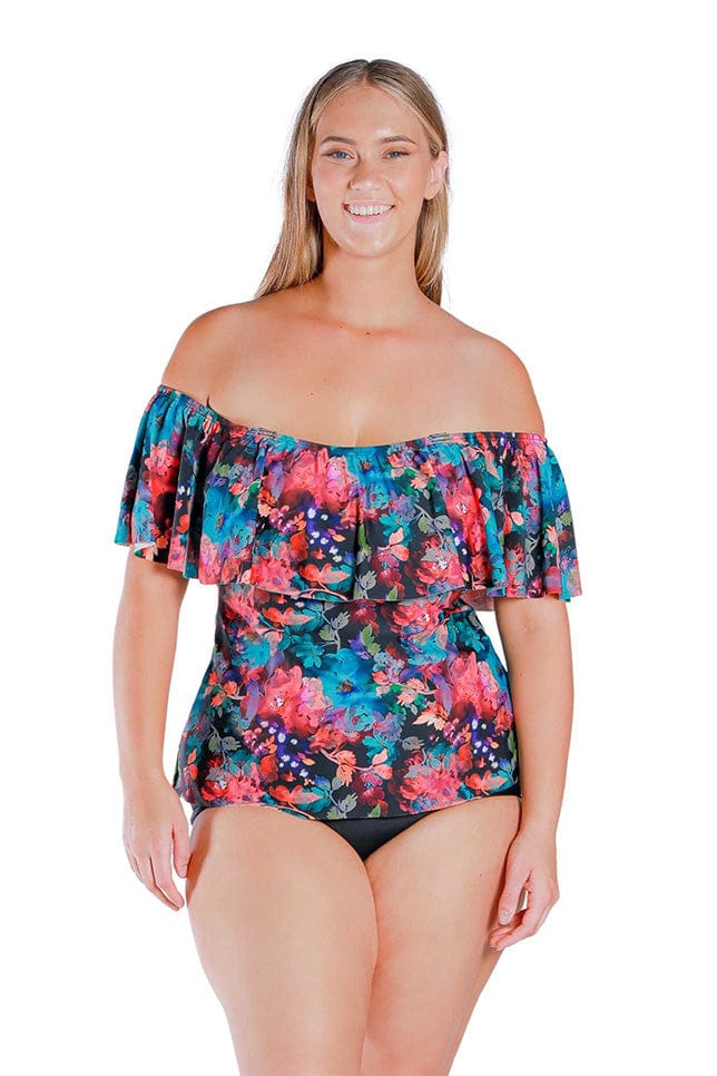 Front view of blonde model wearing pink and blue floral print off shoulder tankini with straps off