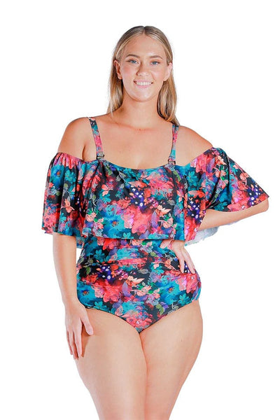 Front view of blonde model wearing pink and blue floral print off shoulder one piece with straps on 
