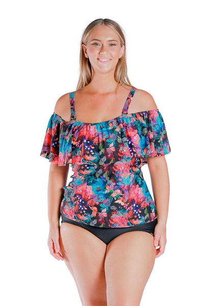 Front view of blonde model wearing pink and blue floral print off shoulder tankini with straps on