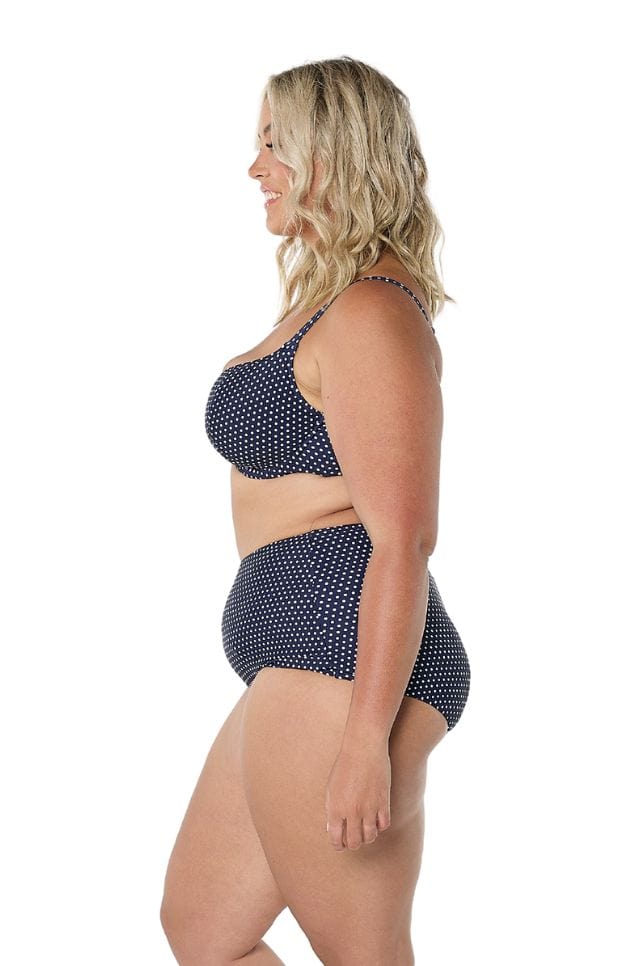Side profile of curve model in studio wearing swim pant
