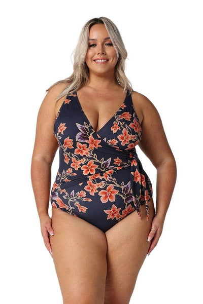 Blonde in studio model wearing a v neck one piece with side tie detail for curve women
