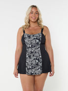 Woman in studio wearing black and white swim dress with paisley panel print Austraila