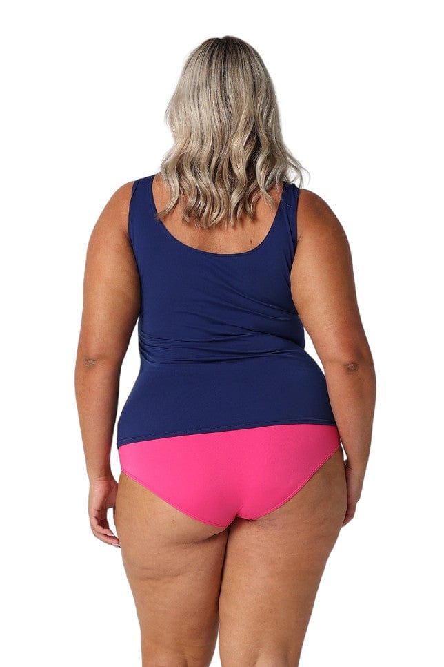 Back of model wearing pink flattering high waist pant for curve woman