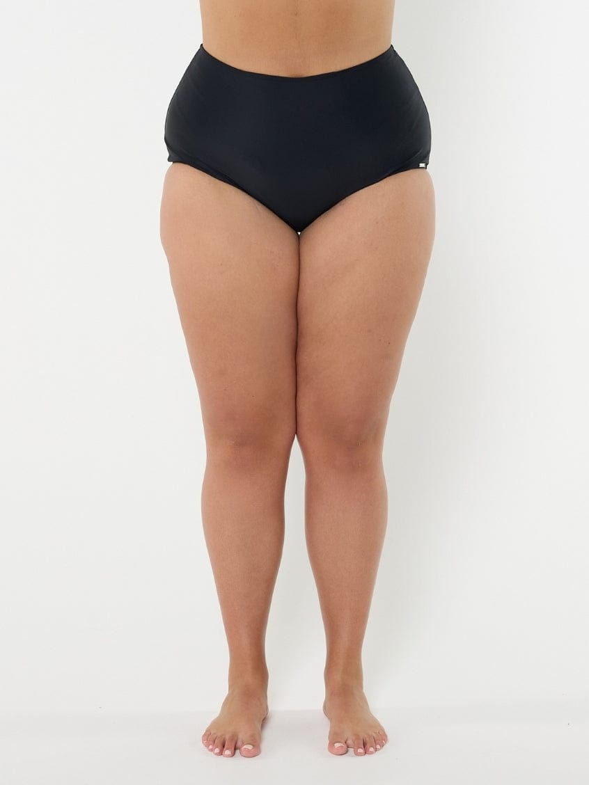 Person wearing black high-waisted bikini bottoms on a white background