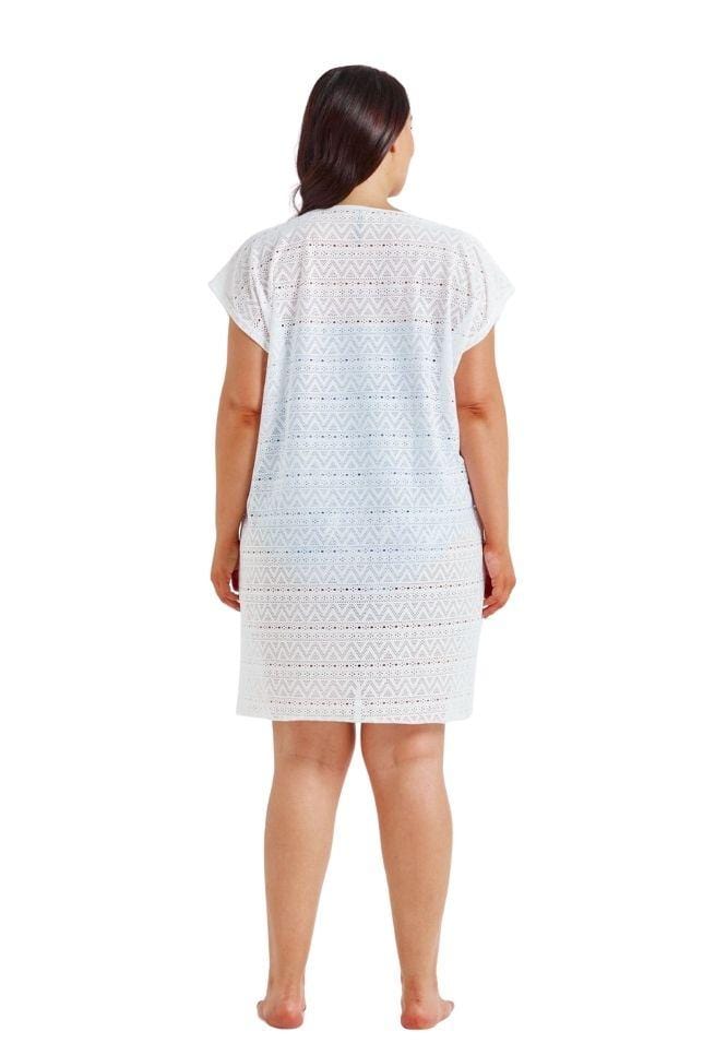 Brunette model showing back of white mesh beach cover up