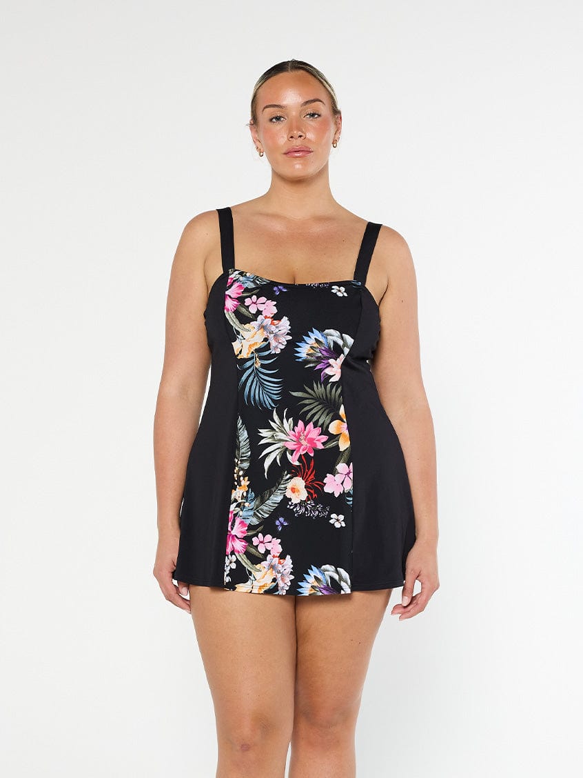 Model shows front of floral wide strap chlorine resistant swim dress with no pant