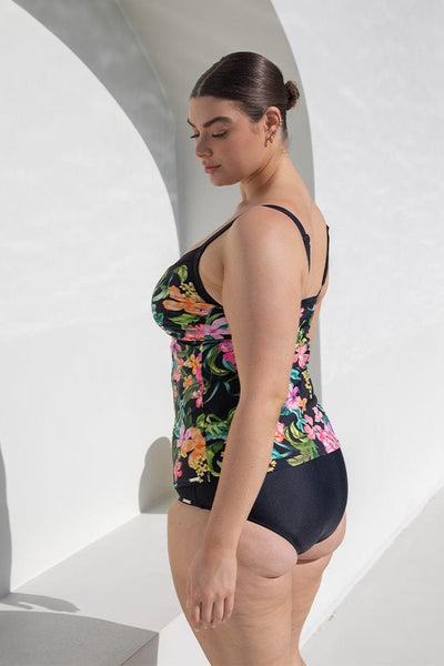 Plus size woman in tropical floral underwire tankini swimsuit