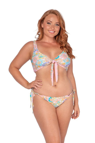 Curve model wearing reversible bikini top with coloured floral and tie detail