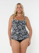 Blonde woman in studio wearing tank tankini top in black and white paisley print