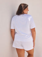 Back of curve model wearing white terry towelling t shirt