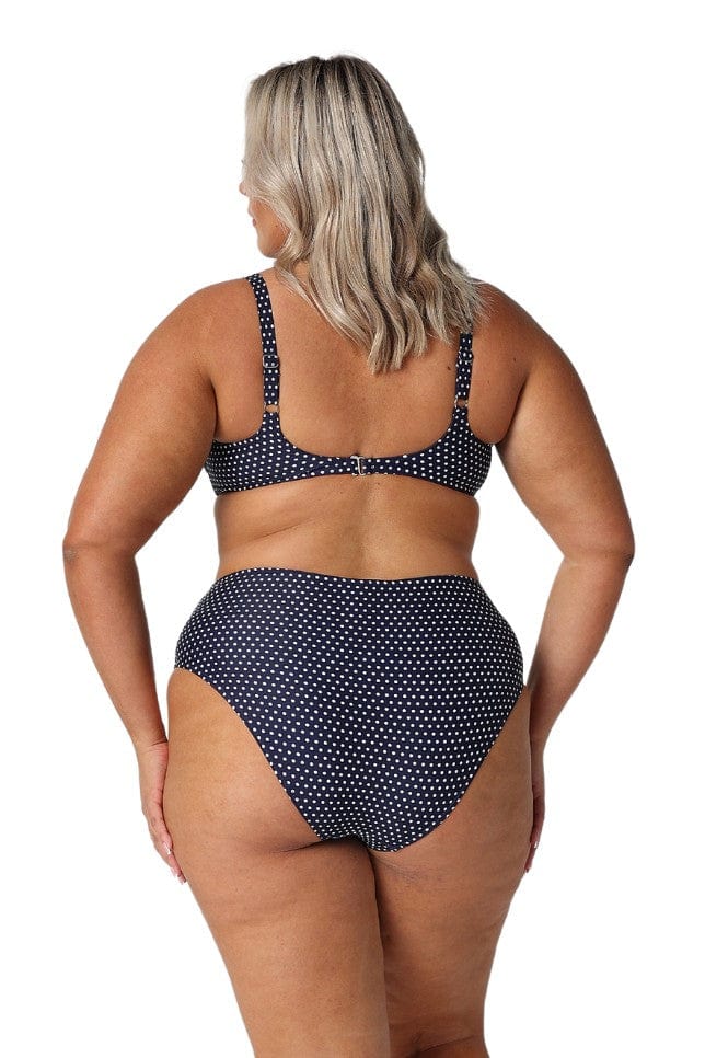 Back of curve model wearing navy and white top bikini top with adjustable straps and 3 size clasp