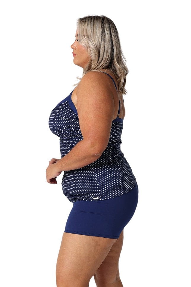 Side profile of model in studio wearing underwire tankini top for curve woman
