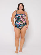 Woman wearing a floral swimsuit on a white background