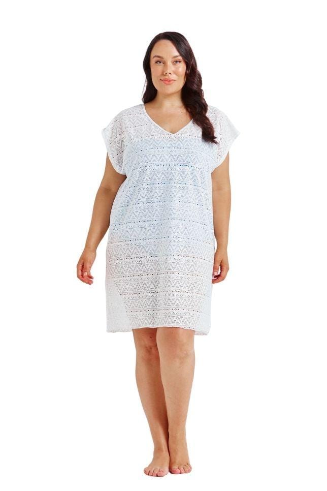 Brunette model wearing white mesh cover up