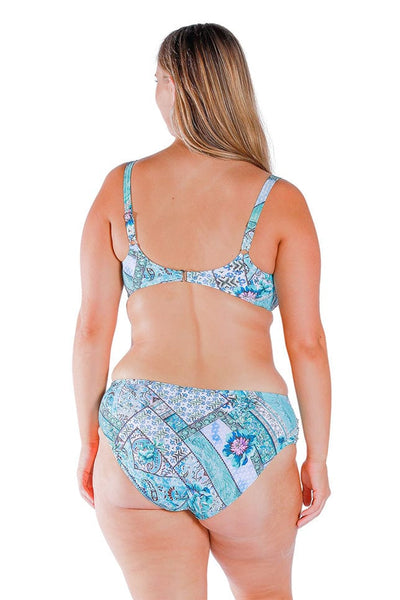 back of plus size model wearing blue and white printed bikini pant 
