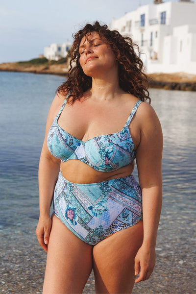 brunette model wearing blue patchwork pattern high waisted swim pant