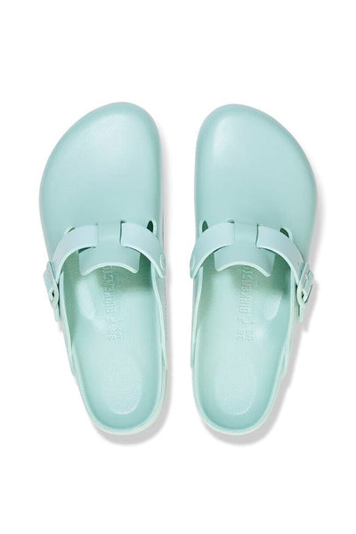 Light green slide on clogs with buckle detail