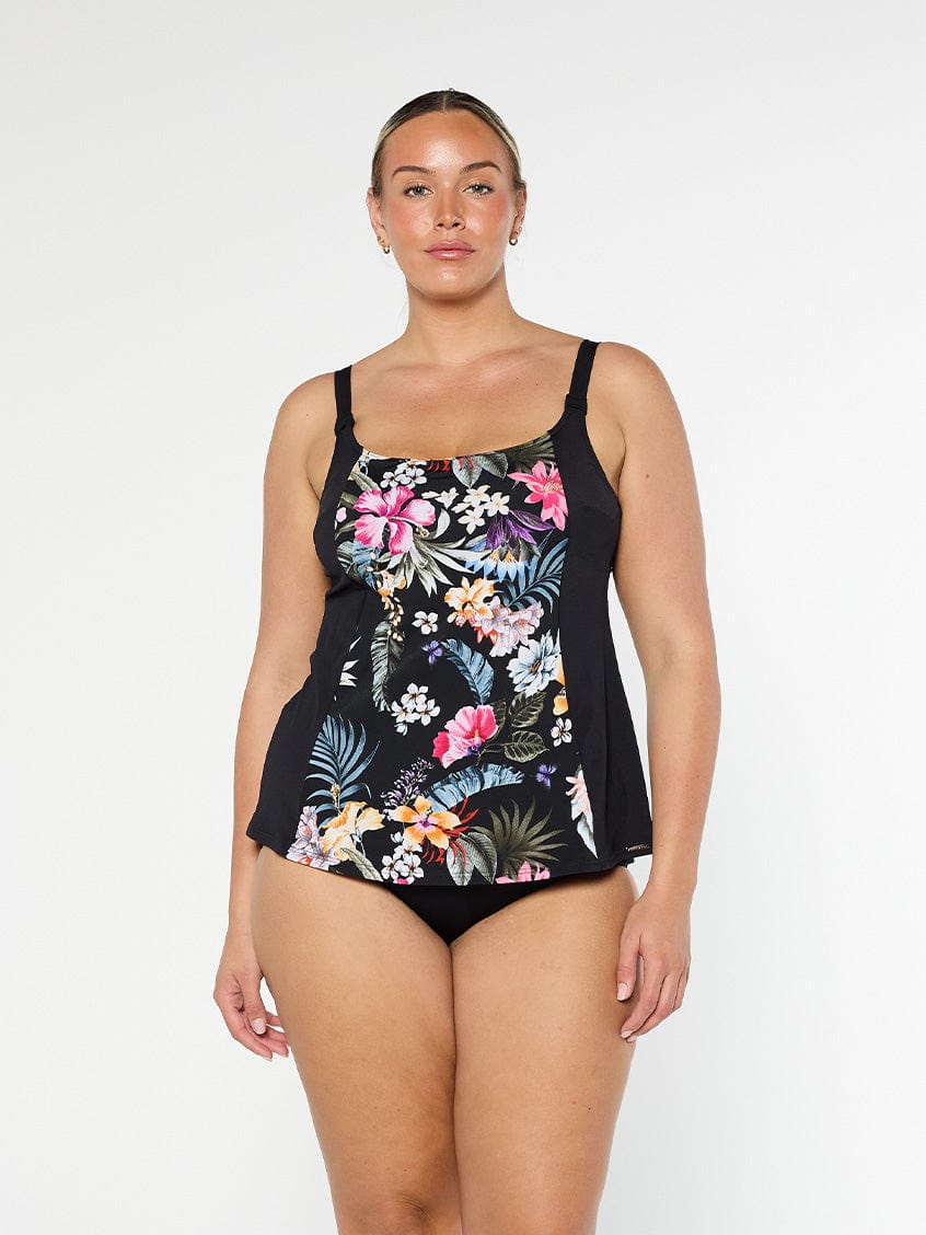 Blonde model wears plus size black floral tankini in chlorine resistant fabric