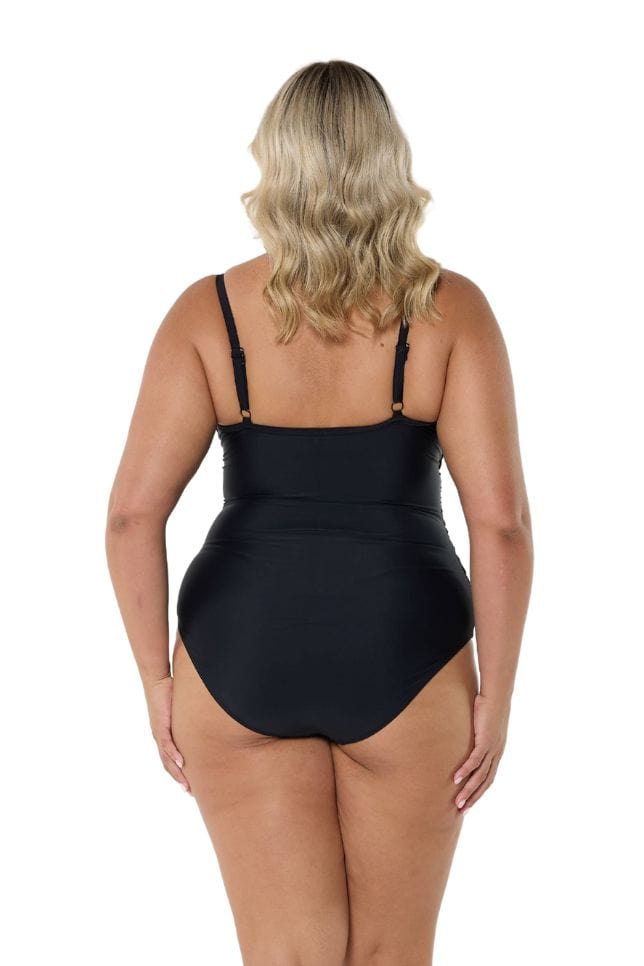 Blonde model showing back of black criss cross one piece swimsuit