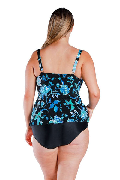 back of plus size model wearing black and turquoise floral printed tankini top with black swim pant