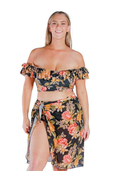 Model wearing wearing yellow, orange and black floral printed long tie side mesh swimming skirt