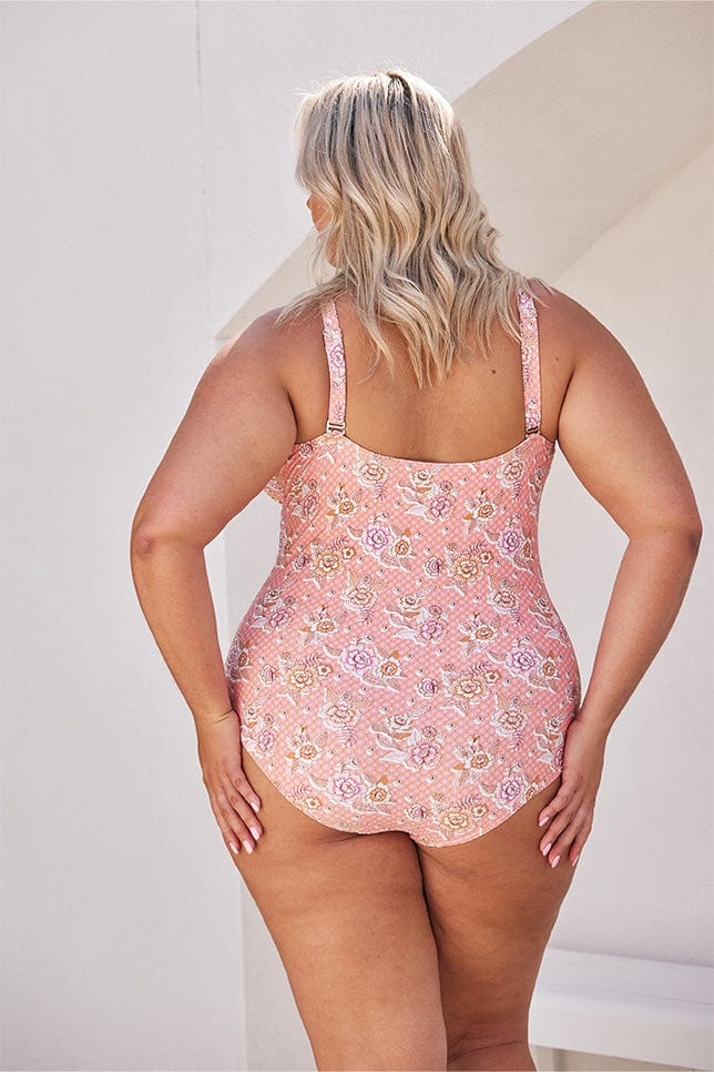 Model showing back of pink floral womens one piece swimwear