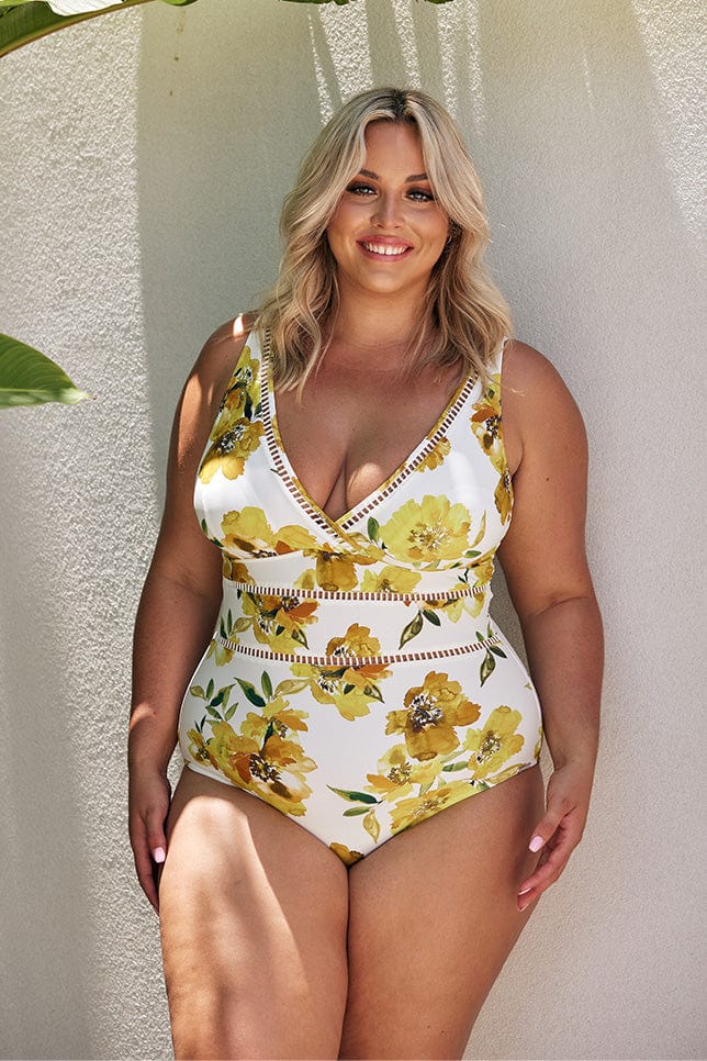 Blonde model wearing yellow floral v neck one piece