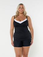 Blonde model showing side of black and white underwire tankini
