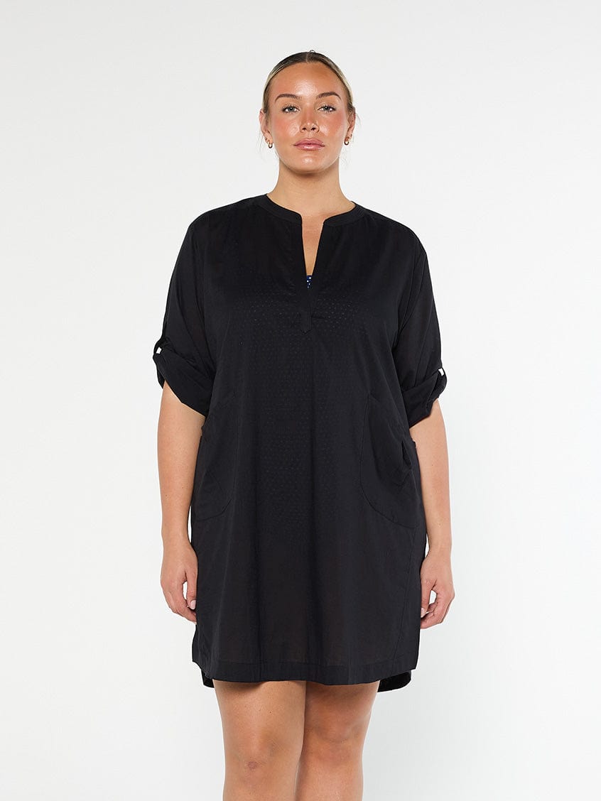 model wearing black over shirt dress