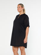 model showing side of black over shirt cover up