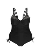 black swimsuit with mesh bust detail and ruched sides