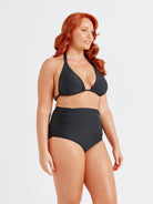 model showing side ruching on black high waisted swim pant