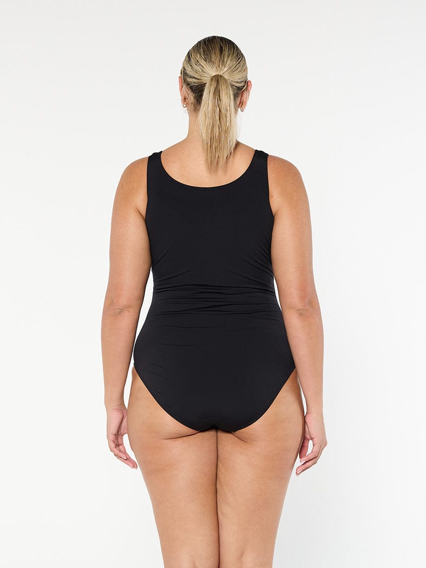 model showing back of black chlorine resistant women's one piece swimsuit
