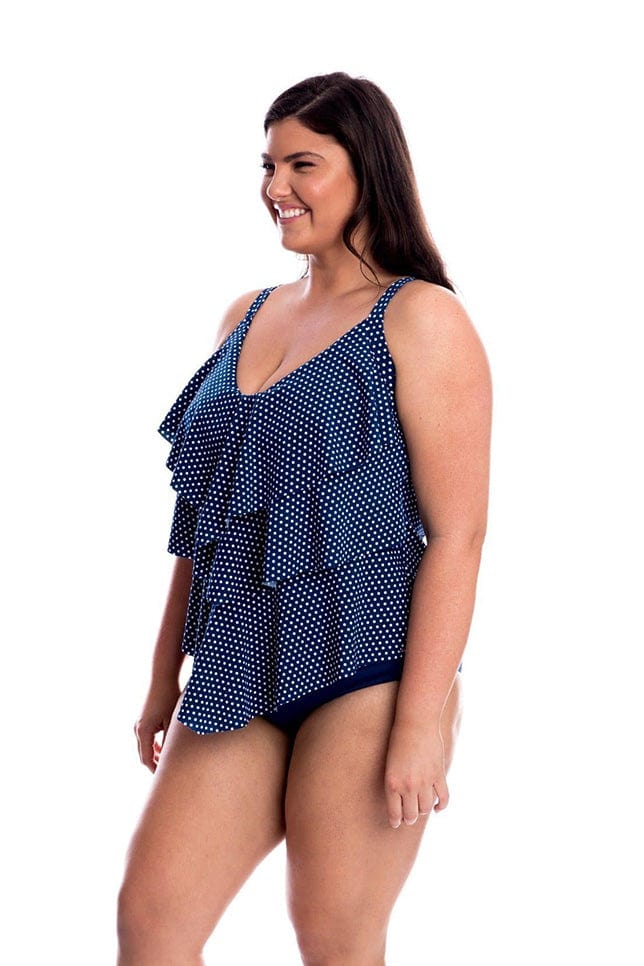 Model wearing navy and white dots ruffle tankini