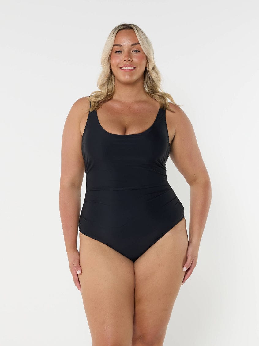 model wearing plain black underwire one piece