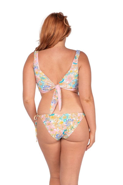 Curve women wearing reversible tie front bikini top with coloured floral print
