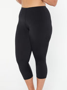 model showing side of women's black swim leggings