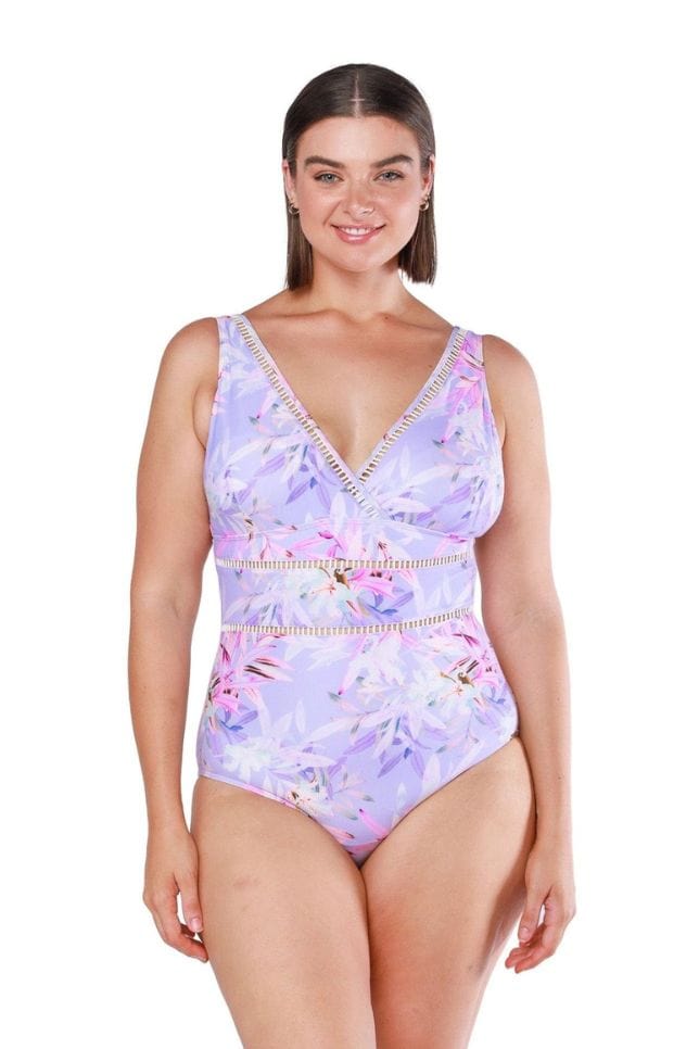 Curve model wearing plunge neck floral one piece with lace trim in purple