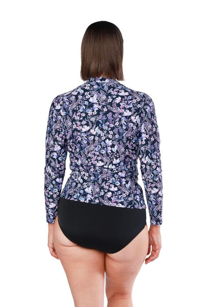 Back of model wearing curve long sleeve rash vest in navy floral print with zip front