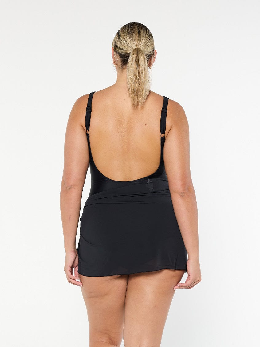 model showing back of black mesh mini skirt