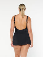 model showing back of black mesh mini skirt