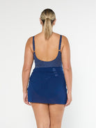 model showing back of navy mesh short tie side skirt