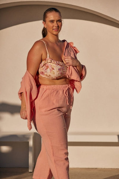 blonde model wearing a musk pink crepe lounge wear set